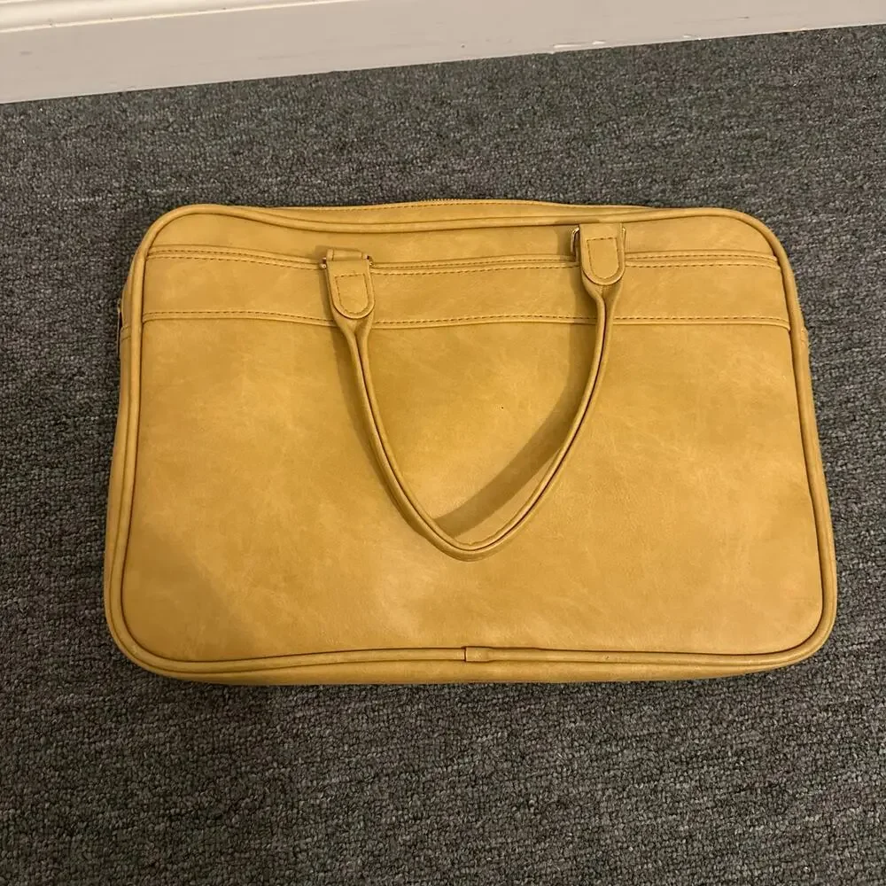 Samsonite Silhouette yellow vinyl carry-on bag